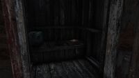 Emplacement d'un magazine potentiel (cabane de toilettes)